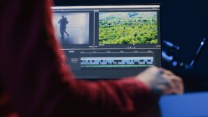 Video editor analyzing film montage before editing color grading and lighting in creative office